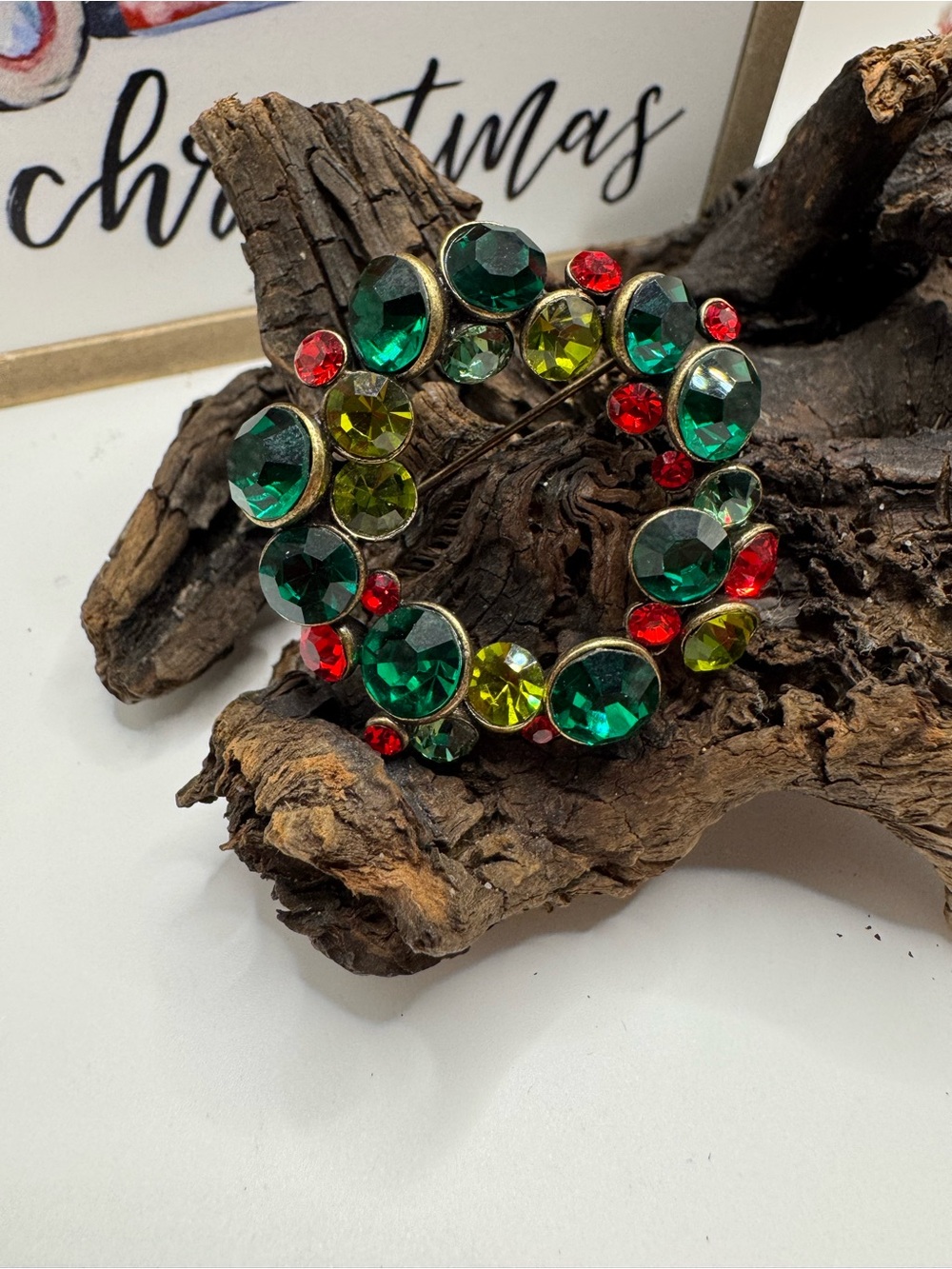 Vintage Christmas wreath brooch, EUC. Green/red rhinestones in burnished metal.